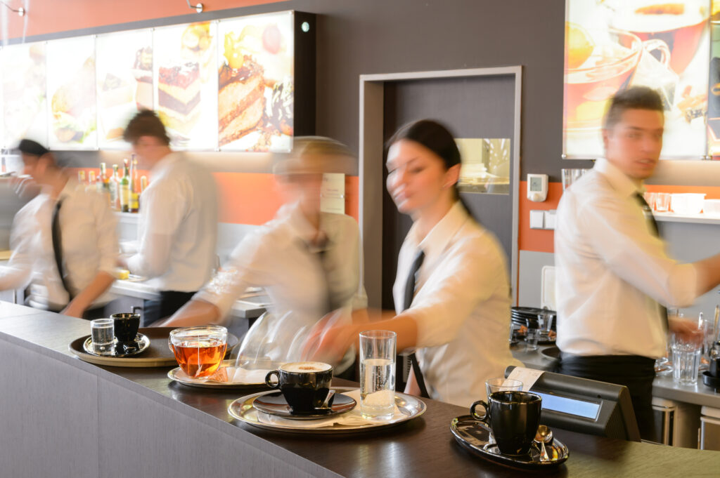 waiter and waitresses working the bar