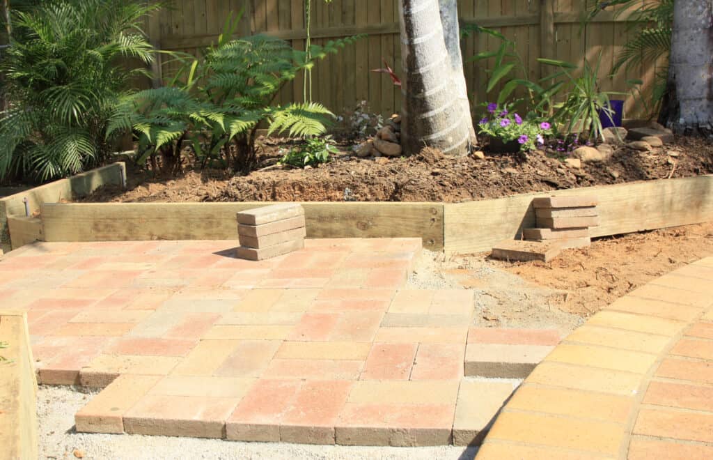 laying paving around the swimming pool