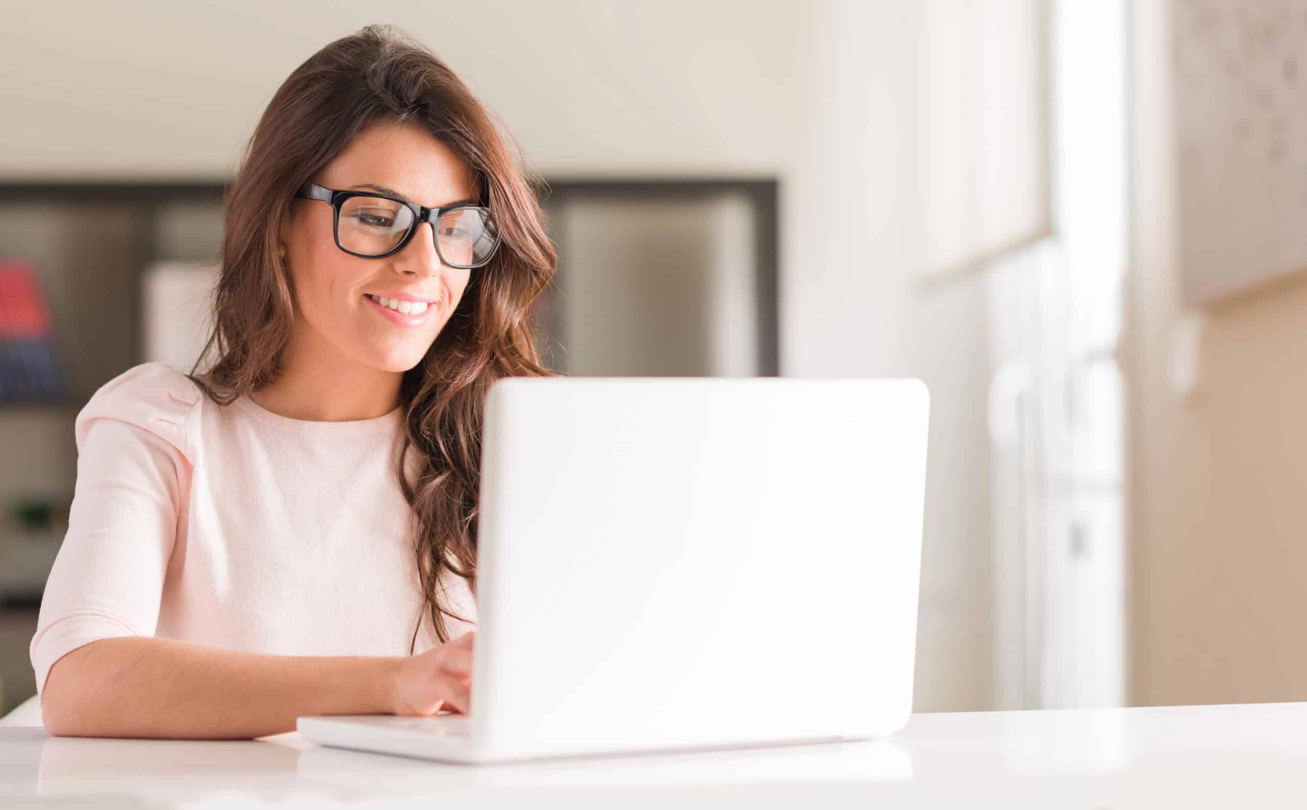woman on a computer wearing glasses